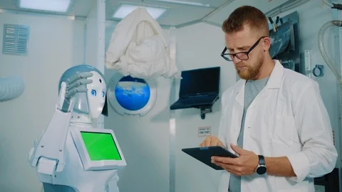 Scientist giving robot a high five Stock Footage 117604198