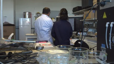 Scientist go over their findings Stock Footage 106901881