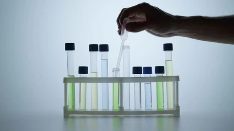 Scientist hand and test tubes Stock Footage 81201276