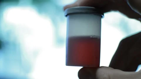 Scientist hold human blood sample on his laboratory. Video stock 229641229