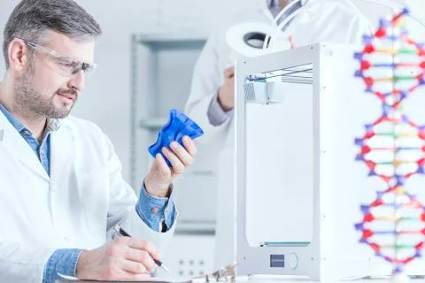 Scientist holding 3d printed object Stock Photos