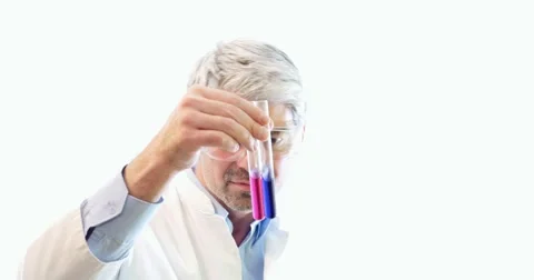 A scientist holding and examining two test tubes with some chemicals in them Stock Footage 48977051