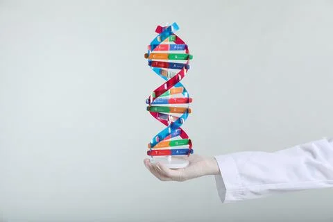 Scientist holding DNA structure model on white background, closeup 스톡 사진