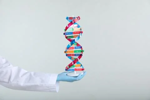 Scientist holding DNA structure model on white background, closeup 스톡 사진