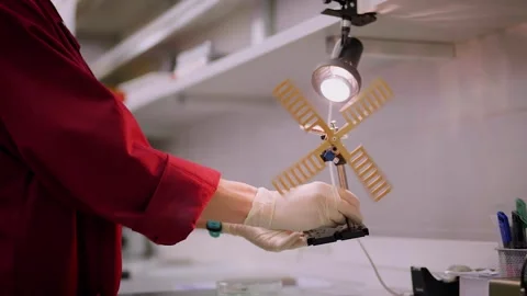 Scientist holding a mini windmill Stock Footage 300718567