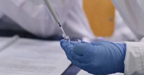 Scientist holds small eppendorf tubes Stock Footage 339366700