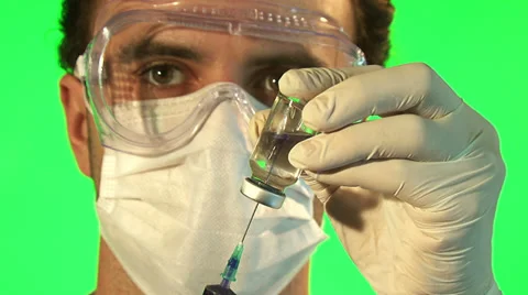 Scientist injecting blue liquid into bottle Stock Footage 38102003