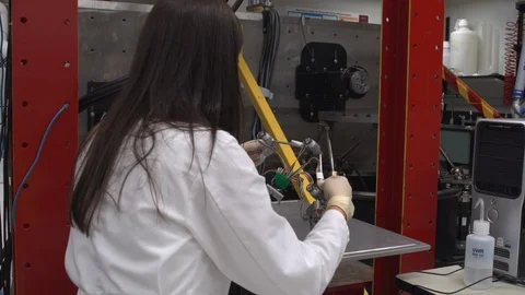 Scientist inspecting a gadget Stock Footage 106900544