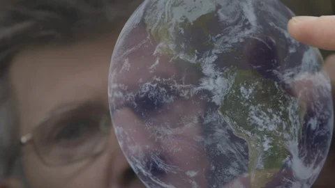 Scientist inspecting an image of the earth on a computer tablet Video stock 103886290