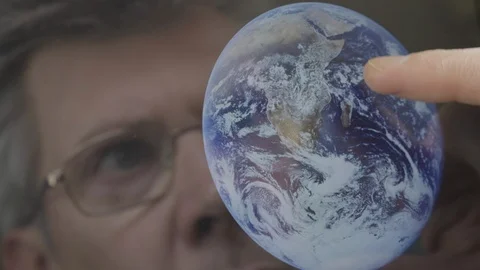 Scientist inspecting an image of the earth on a computer tablet Video stock 103892438
