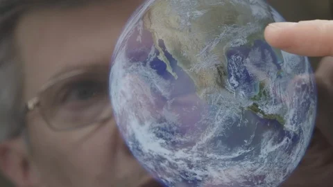 Scientist inspecting an image of the earth on a computer tablet Stock Footage 103897719