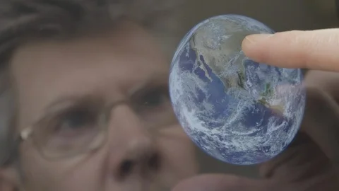 Scientist inspecting an image of the earth on a computer tablet Video stock 103902964