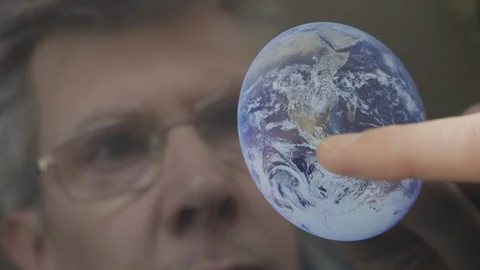 Scientist inspecting an image of the earth on a computer tablet Video stock 103907766
