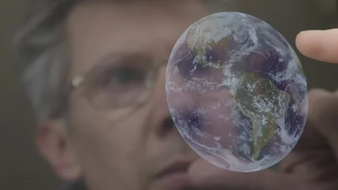 Scientist inspecting an image of the earth on a computer tablet Video stock 103913889
