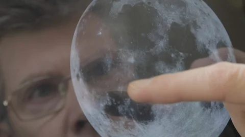 Scientist inspecting an image of the moon on a computer tablet Video stock 103919450