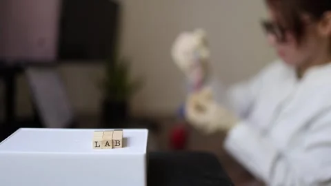 Scientist inspects sample in laboratory Stock Footage 337571428