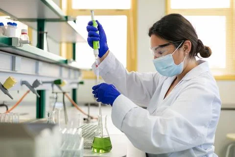 A scientist in the lab doing an experiment Stock Photos