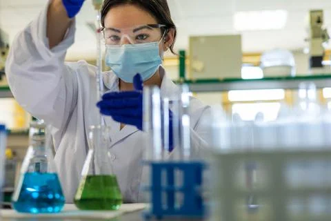 A scientist in the lab doing an experiment Stock Photos