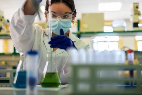 A scientist in the lab doing an experiment Stock Photos