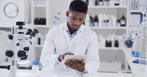 Scientist, lab or black man with tablet for medical research, discovery or .. Stock Photos