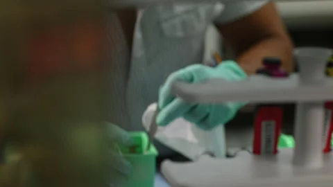 Scientist in Lab organizing slides 動画素材 209166774