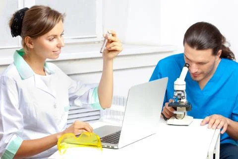 Scientist in laboratory analyzing liquid in test tube Stock Photos