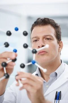 Scientist, laboratory and man with molecule structure for theory testing and Stock Photos