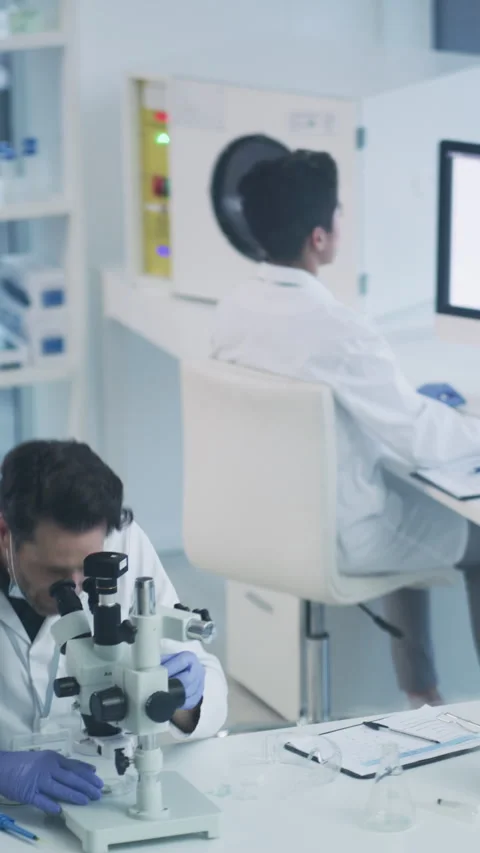 Scientist, laboratory and team with microscope for test analysis, medical Stock Footage 331591751