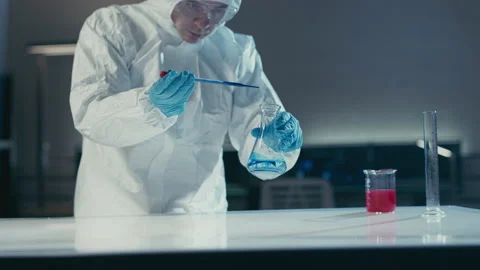 Scientist in laboratory checking liquids with pipette Stock Footage 149248231