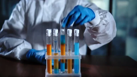 Scientist in the laboratory examines a test tube. New technology, cure Stock Footage 95194574