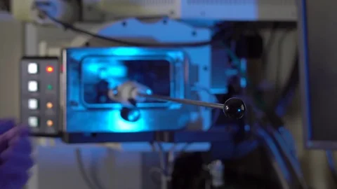 Scientist in a laboratory put samples into electron microscope for investigation Video stock 77981868