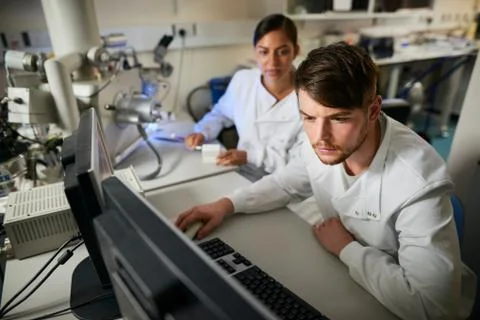Scientist in laboratory using computer 스톡 사진