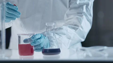 Scientist in laboratory working with test tubes and liquids Stock Footage 149246822