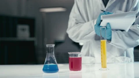 Scientist in laboratory working with test tubes Stock Footage 149248506