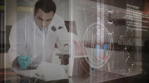 Scientist leaning into microscope, adjusting focus and writing notes while AR Stock Footage 332613756
