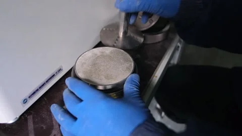 The scientist loads the sample into the device. Soil study in the laboratory Stock Footage 231740390