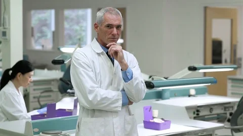 Scientist looking at camera in a laboratory 動画素材 77078636