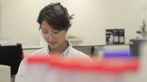 Scientist looking at liquid in laboratory Stock Footage 5091543