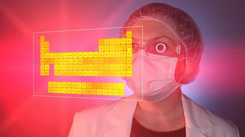 Scientist looking at periodic table of elements Video stock 88191216