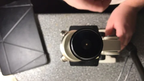 Scientist looking through a microscope Stock Footage 102772143