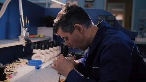 Scientist looking through a microscope in a laboratory Stock Footage 104924387