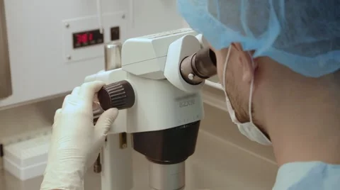 Scientist looking through a microscope, medical research Stock Footage 46496300