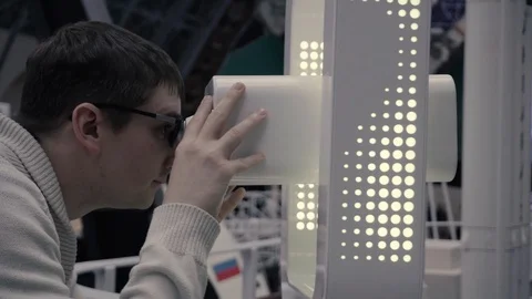 Scientist looking into VR glasses, science centre office. Stationary 3D googles. Stock Footage 111461103