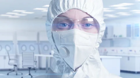 Scientist looks into the camera for a shot close-up portrait. Video stock 161636823