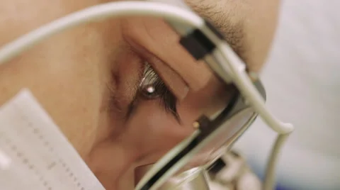 Scientist looks through a microscope Stock Footage 64804513