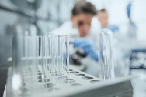 Scientist looks through a microscope in a laboratory. research concept 스톡 사진