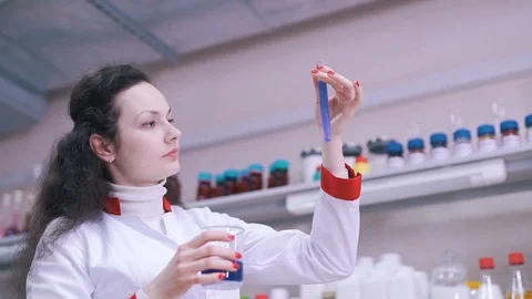 A scientist looks at vaccine prototypes in a test tube Stock Footage 112151755