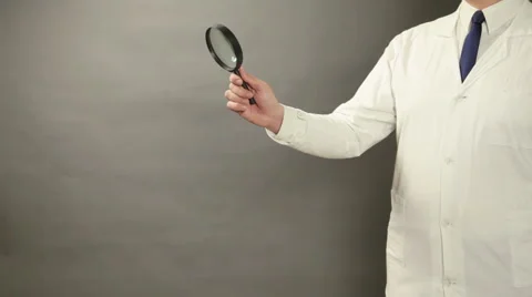 A Scientist with a Magnifying Glass Vídeos de archivo 62332230