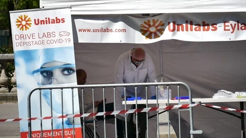 Scientist making covid test in Paris close up -COVID19 Stock Footage 128605229
