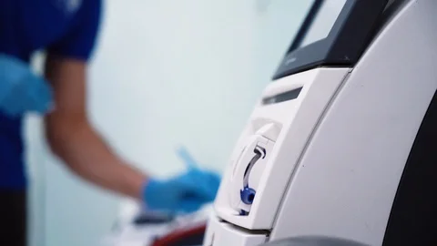 Scientist making notes while working in his lab. genetic biohacking research Stockbeeldmateriaal 121270372